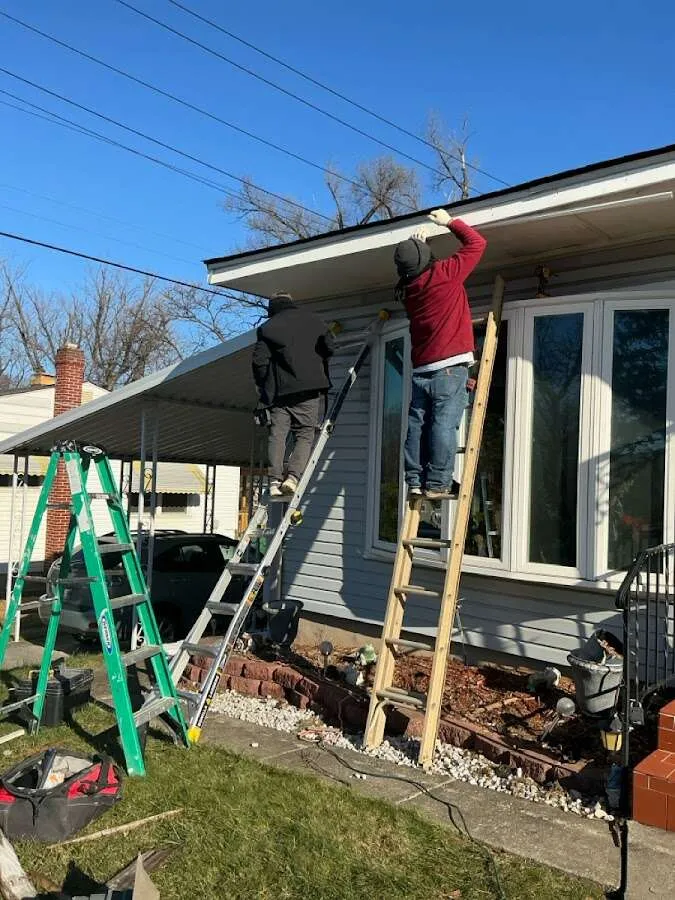 Restoration crew performing exterior repair in Island Lake